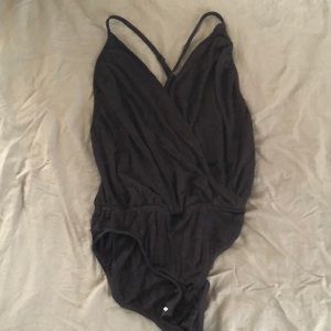 Black Leo deep V with open back size S
